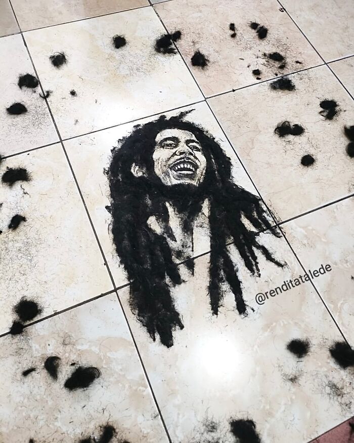 Unique portrait made from cut hair on a tiled floor by a creative barber.