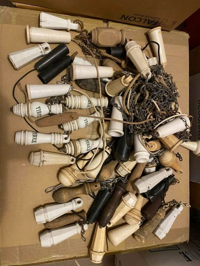 Unique collections of vintage corkscrews and chains on display.