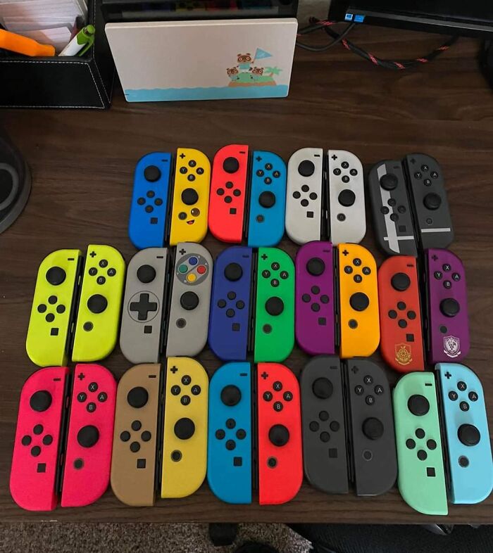 Colorful Switch Joy-Con controllers arranged on a table, showcasing an unexpected unique collection.