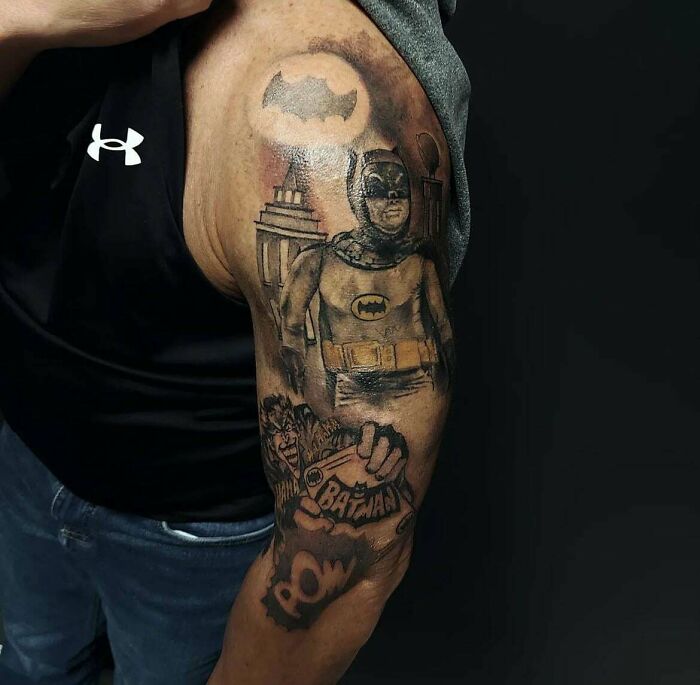 Funny worst tattoo fails featuring a poorly drawn superhero tattoo on a person's arm.