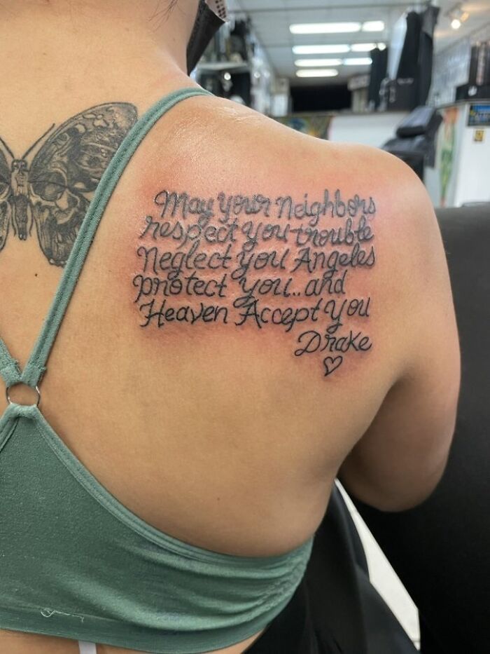 Tattoo with text on a person's shoulder, humorously featuring a common mistake in lettering. Funny worst tattoo fails.