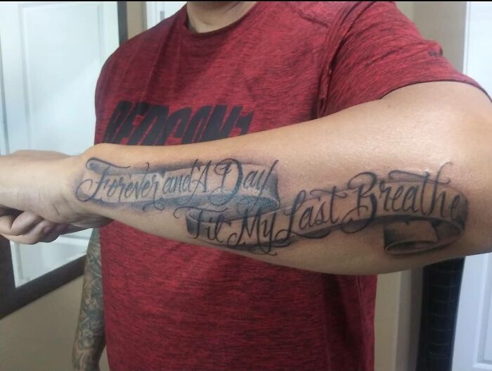 Tattoo on arm reading "Forever and a day til my last breathe" with a misspelled word, illustrating a funny worst tattoo fail.
