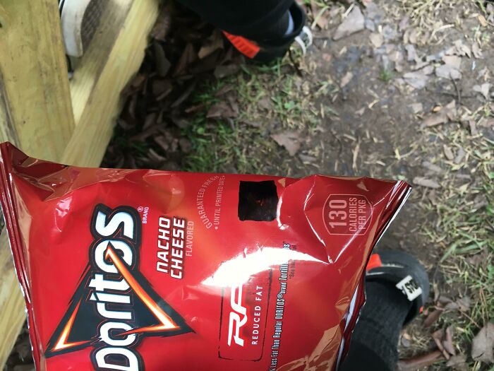 A child's treat of Doritos Nacho Cheese chips during a typical school day, symbolizing common school experiences in the US.