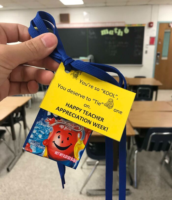 Classroom setting with a Kool-Aid pack attached to a blue ribbon for Teacher Appreciation.