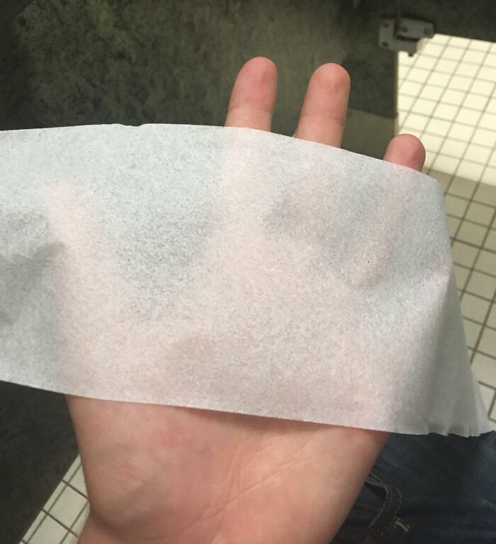 Thin toilet paper in a school restroom highlights horrifying US school experiences.