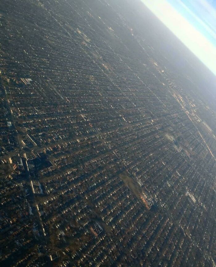 Aerial view of dense urban landscape showcasing 'urban hell' with endless rows of houses.