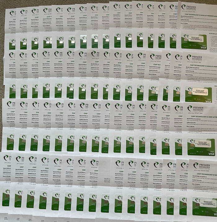 Rows of identical credit cards with green design, a fascinating sight showing duplication and detail.