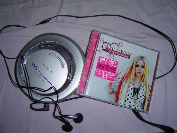 Sony Walkman with Avril Lavigne CD, showcasing old internet feel pics vibes.