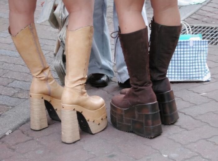 Retro platform boots on a city street, evoking an old-internet feel with nostalgic fashion elements.