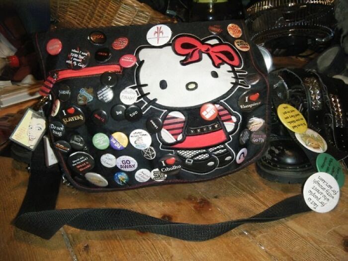 Hello Kitty bag with vintage pins, capturing old-internet nostalgia.