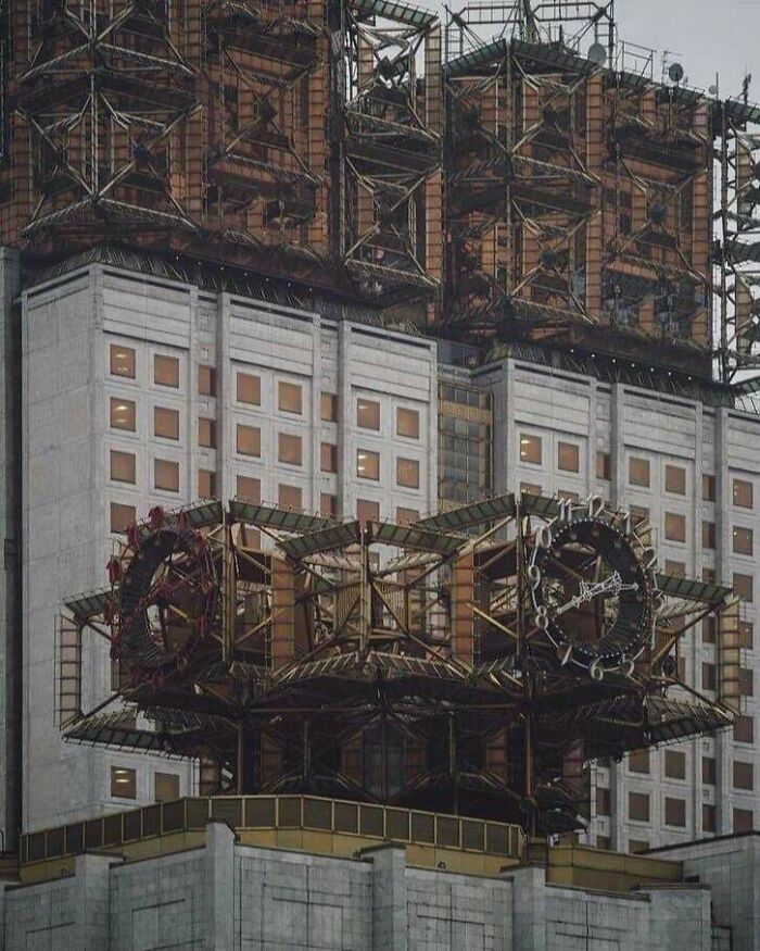 Futuristic urban architecture with complex metal structures and grids.