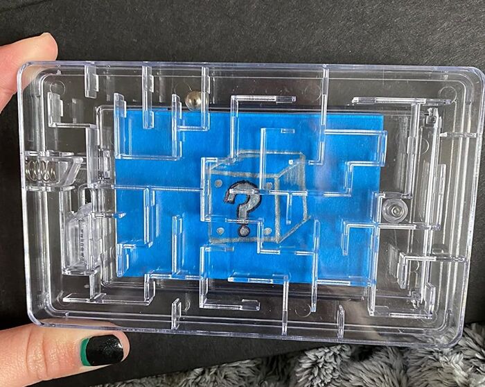 Clear puzzle box with a question mark on blue background, ideal as a unique gift for teachers.