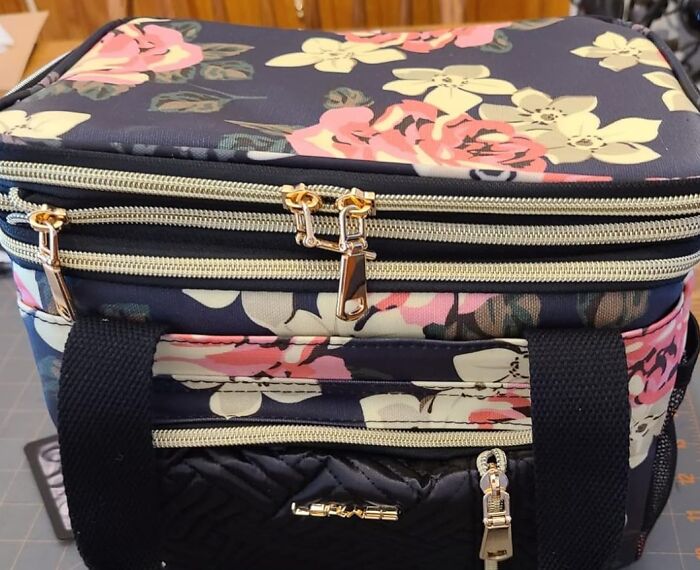 Floral insulated lunch bag, ideal gift for teachers, featuring double zippers and black handles.