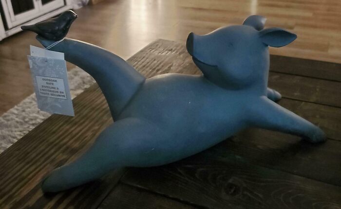 A pig sculpture with a bird on its foot, a common example of disappointing gifts.