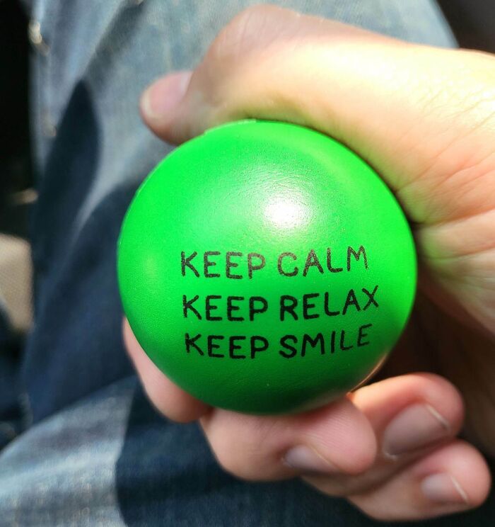 Green stress ball with text, symbolizing disappointing gifts.