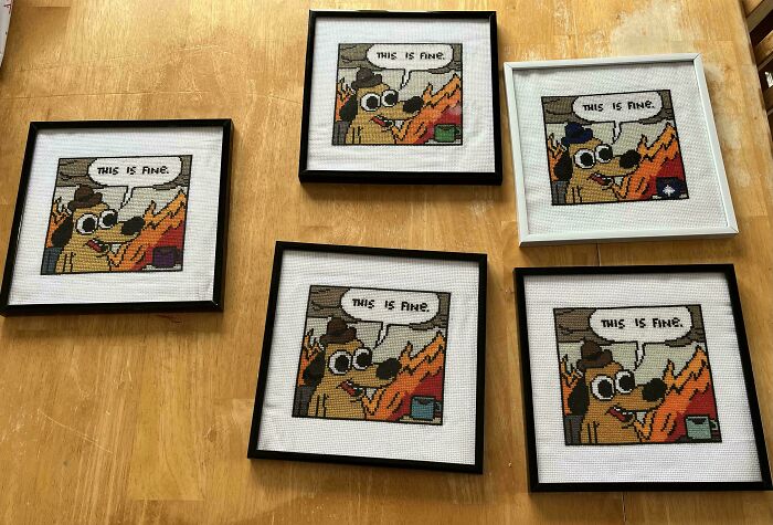 Framed cross-stitch art of a dog in a burning room saying "This is Fine," perfect trolling Christmas gifts.