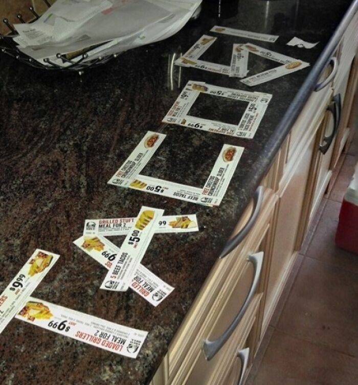 Coupons arranged humorously on a kitchen counter, showcasing funny pregnancy situations.