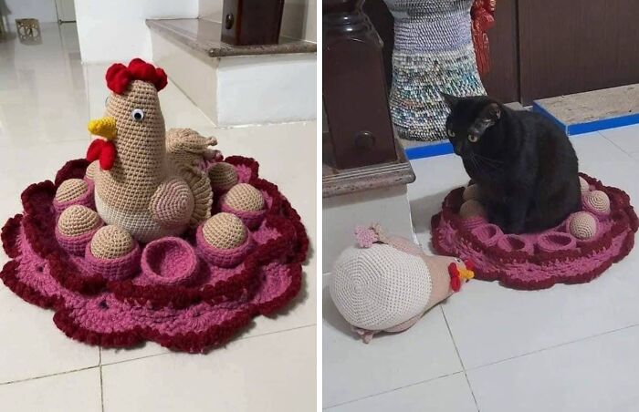 Crocheted hen on a nest of eggs, next to a black cat sitting on the same nest, representing a blessed image.