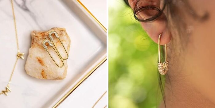 Gold earrings and necklace set, a perfect gift for your mom, displayed on a marble tray and worn in an ear.