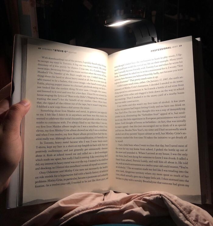 Open book under a reading light, illustrating perfect Christmas gifts that make moms cry happy tears.