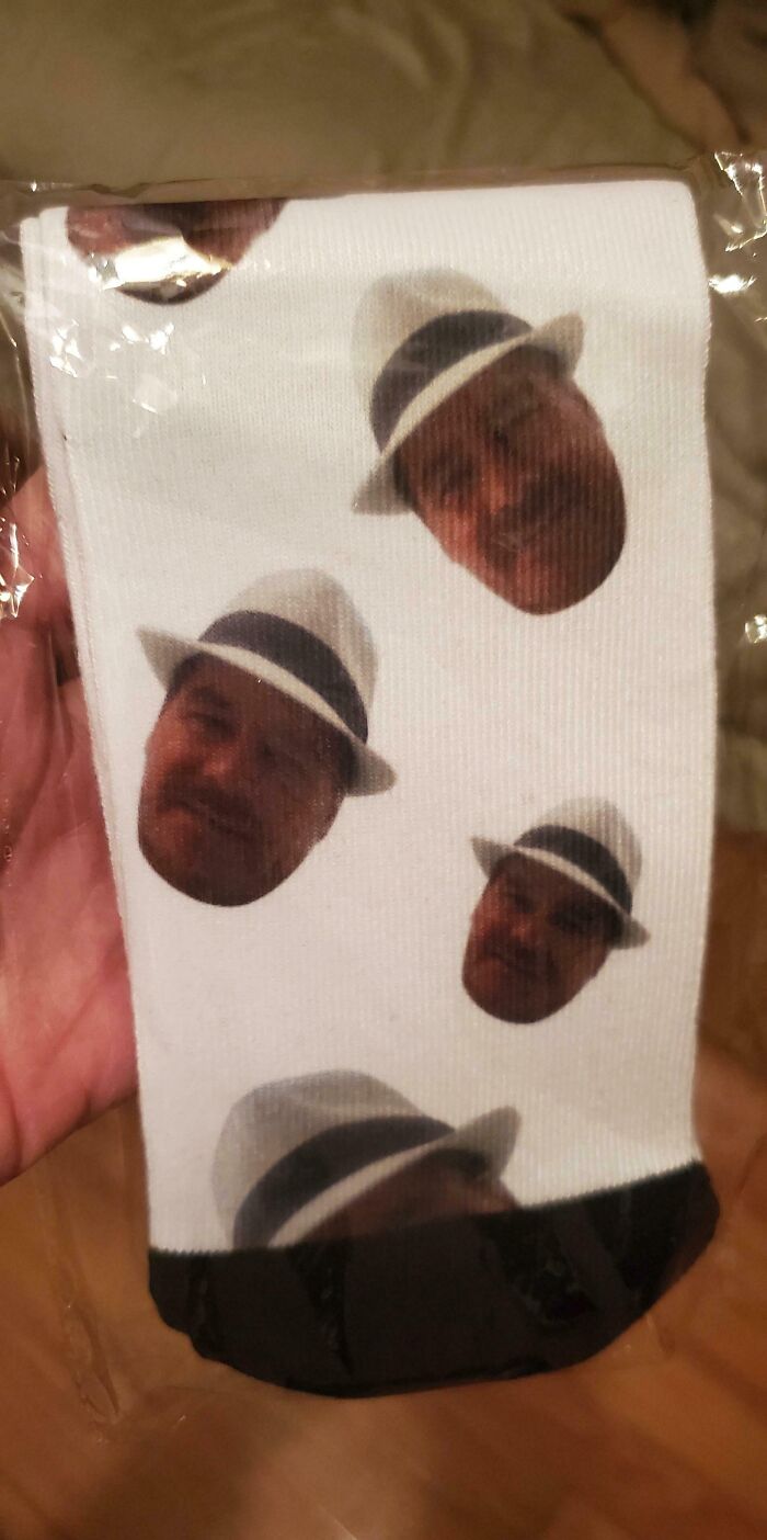 Personalized socks with a repeated face wearing a hat, perfect hilarious trolling Christmas gift.
