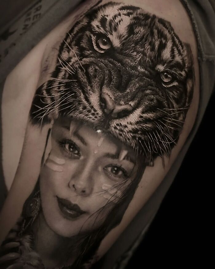 Realism in tattoo art depicting a woman with a tiger headdress.