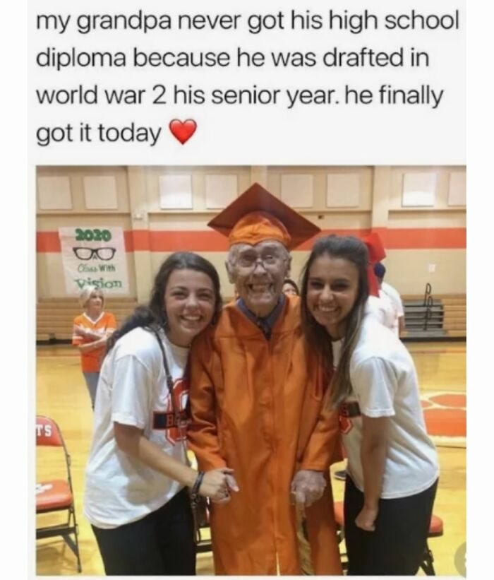 Grandfather receives high school diploma surrounded by happy family, a wholesome moment.