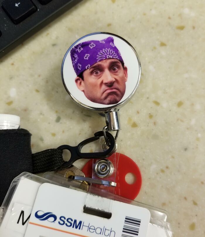 Funny badge reel featuring a popular TV character's face, great for trolling Christmas gifts.