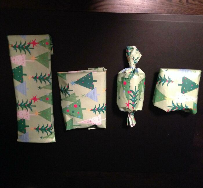 Christmas gifts wrapped humorously in tree-patterned paper.