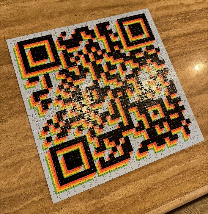 QR code puzzle on a table, highlighting disappointing gifts theme.