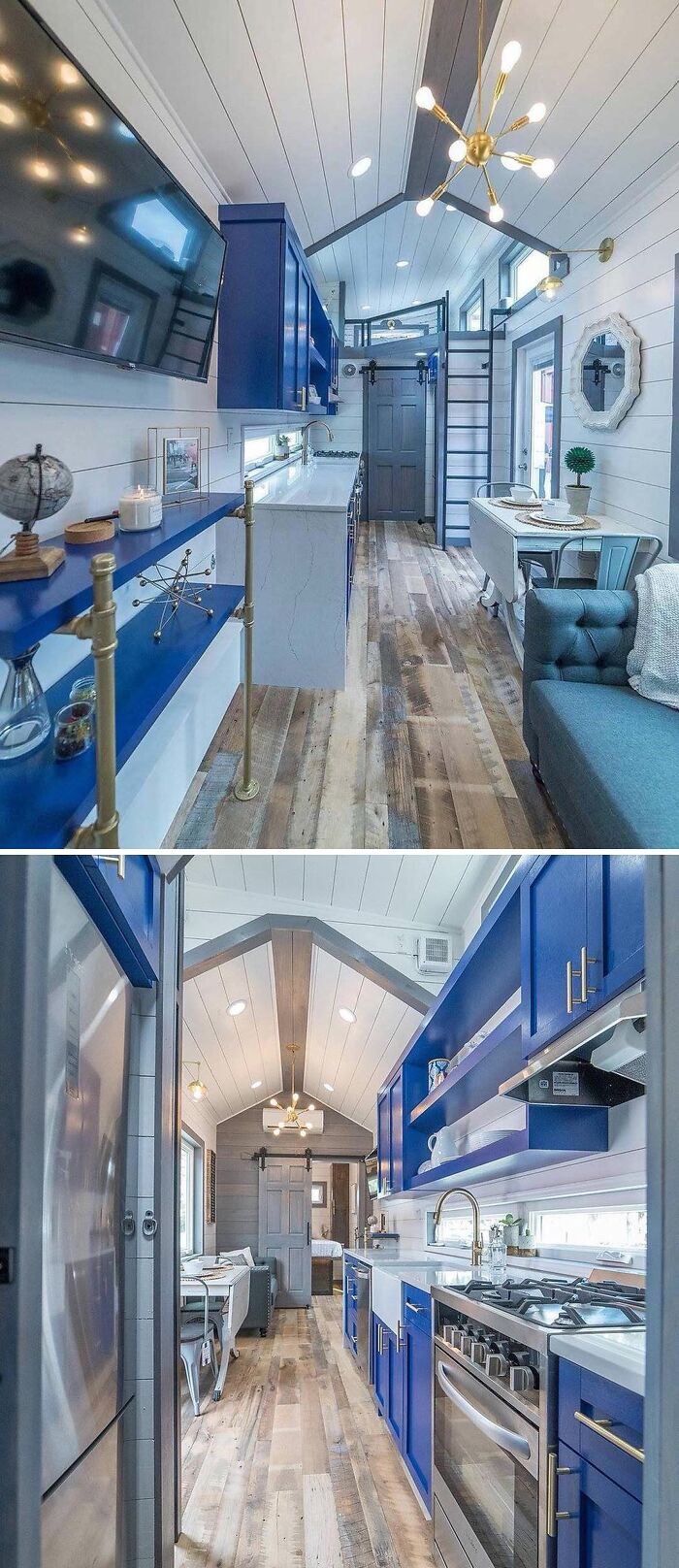 Interior of a modern tiny home with blue cabinets, wooden flooring, and contemporary decor.