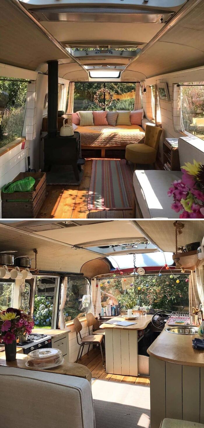 Cozy interior of a tiny home on wheels, featuring a seating area, stove, and kitchen space filled with natural light.