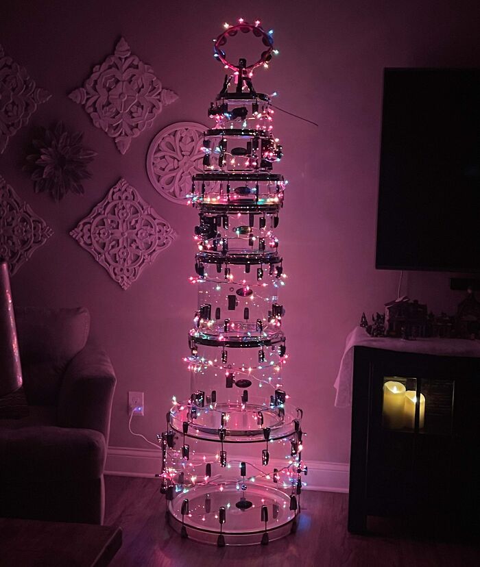 Unique Christmas tree idea with drum kit adorned in colorful lights, creating a festive atmosphere indoors.