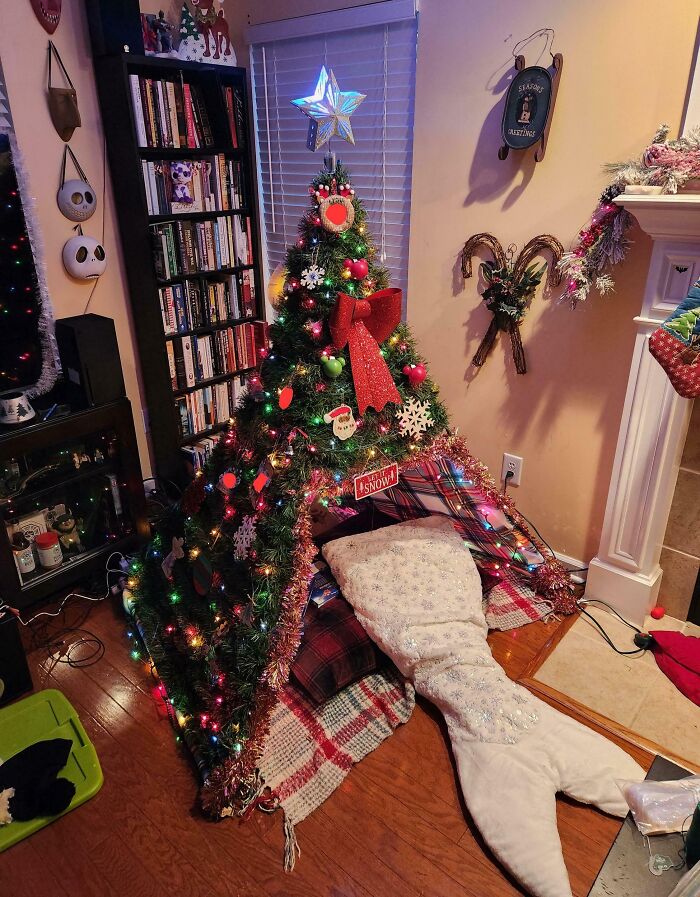 Creative Christmas tree idea decorated with colorful lights, ornaments, and a star, set in a cozy living room.