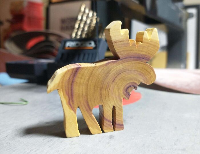 Handcrafted wooden moose figurine for DIY Christmas decorations.