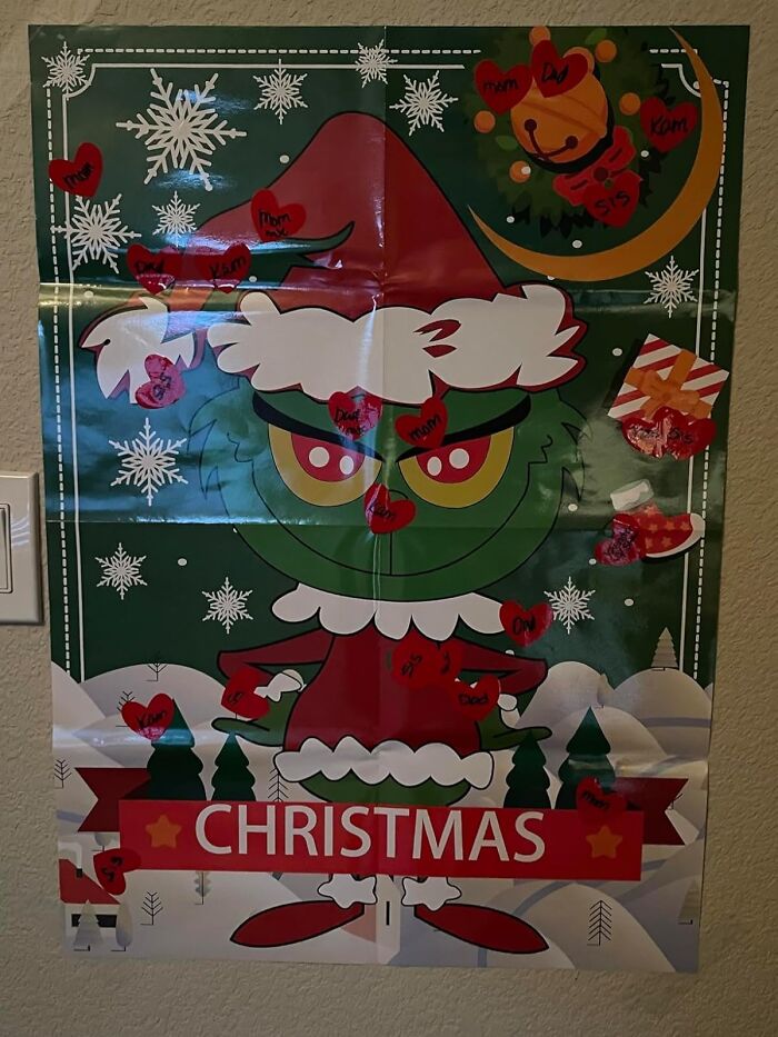 Poster of a cartoon Grinch in a Santa outfit with Christmas decorations, perfect for kids entertained when cold outside.