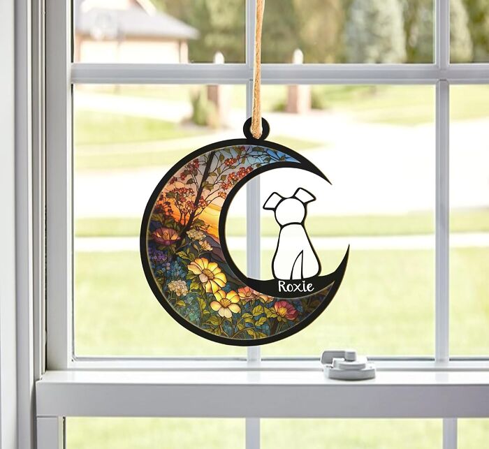 Hanging crescent moon pet ornament with floral design and personalized dog silhouette, perfect gift for pet lovers.