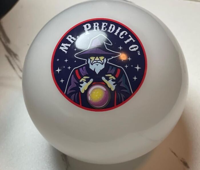 White Elephant gift idea featuring a Magic 8 Ball styled as Mr. Predicto with a wizard design on top.