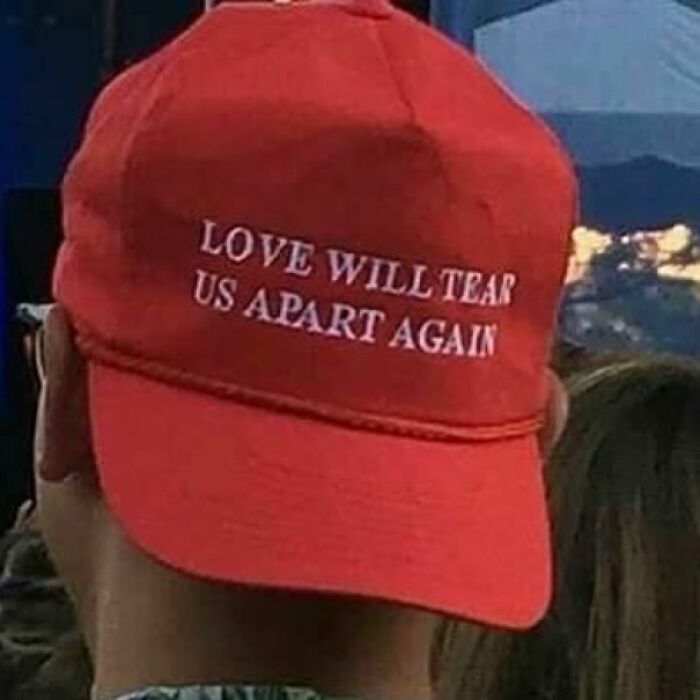 Red cap with "Love Will Tear Us Apart Again" text, epitomizing IG page's focus on weirdness.