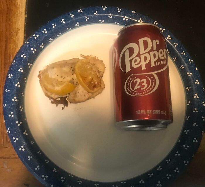 A paper plate with a piece of lemon chicken and a can of Dr Pepper, related to infuriating family members.