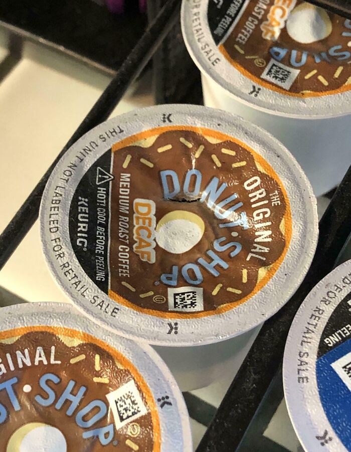 Close-up of a mislabeled decaf coffee pod, potentially causing infuriating family moments.
