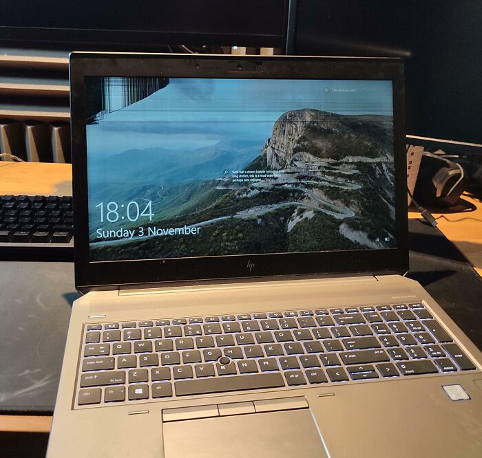 Damaged laptop screen displaying cracks on a desk, related to infuriating-family-members scenario.