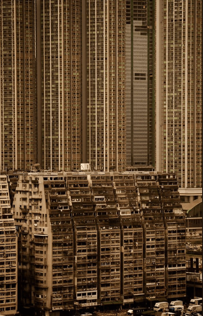 Massive residential buildings tightly packed showcasing extreme size for megalophobia fear of large structures.