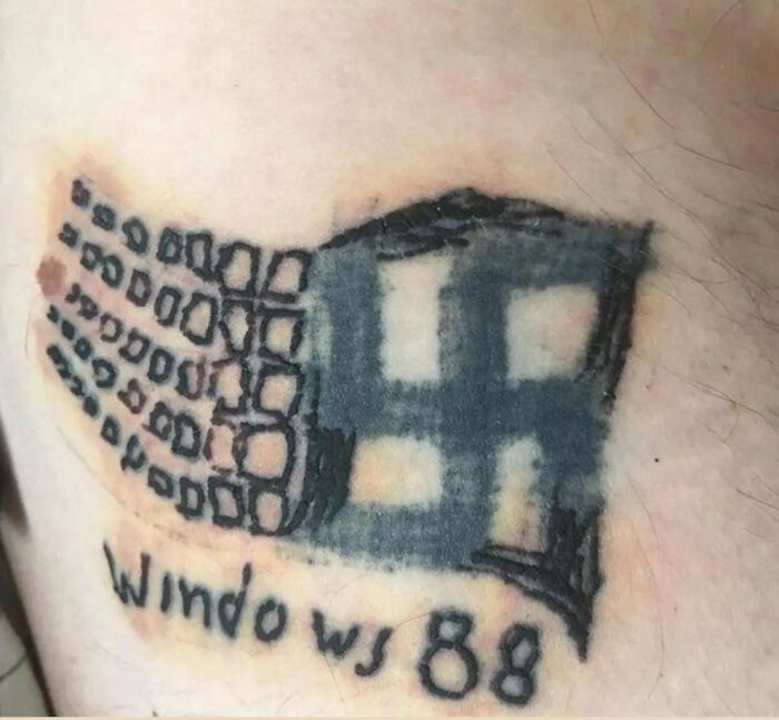 Bad tattoo of misspelled Windows logo with "88" on skin, showcasing a common tattoo fail.