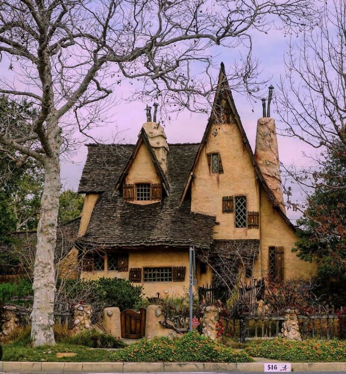 Charming house with whimsical architecture resembling a fairytale setting, evoking a videogame aesthetic.