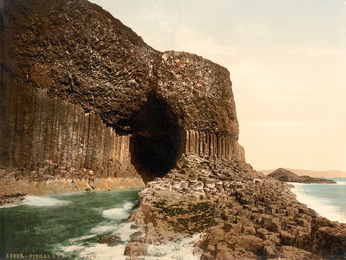 Historic color photo of Fingal's Cave showing the natural sea entrance and basalt columns.