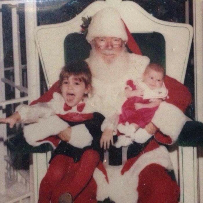 Creepy Santas with distressed kids on his lap in a vintage holiday photo.