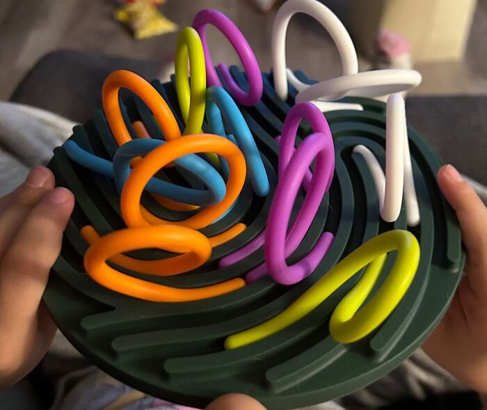 Colorful sensory toy with twisty wires held by a person, showcasing one of the best buys from Amazon this year.