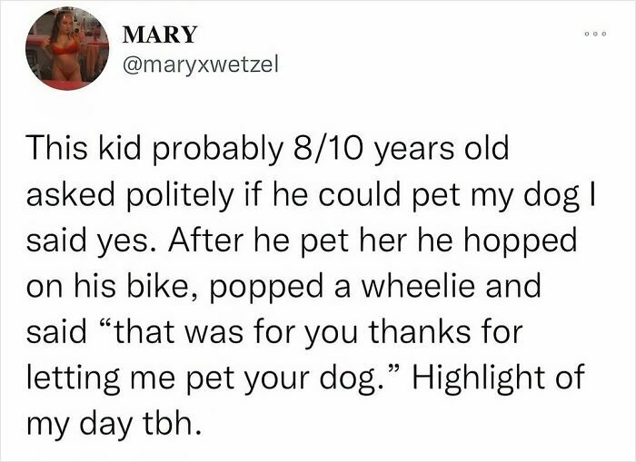 Kid thanks person for petting dog, pops wheelie on bike; humorous moment shared online.