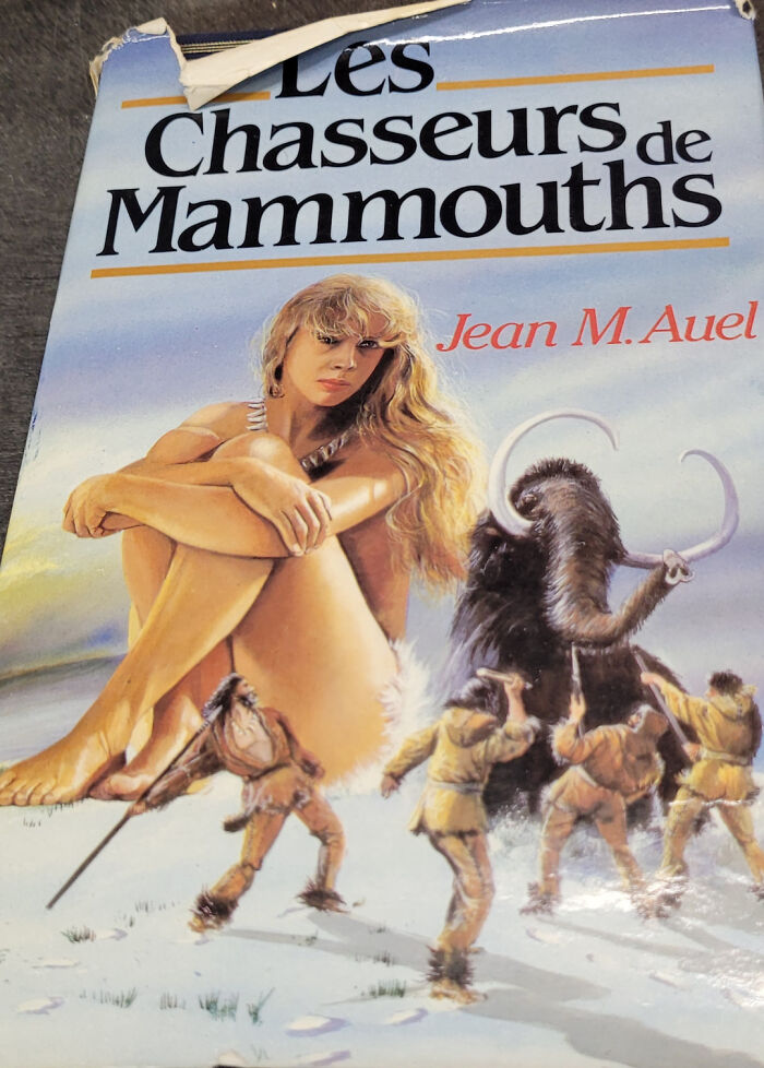 Terrible book cover illustration with seated woman and mammoth hunters in the snow.